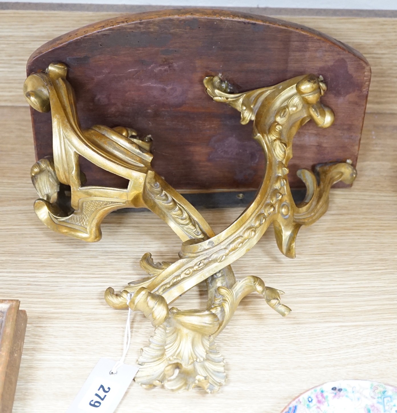 A French ormolu wall bracket, later mahogany top. 29x33cm